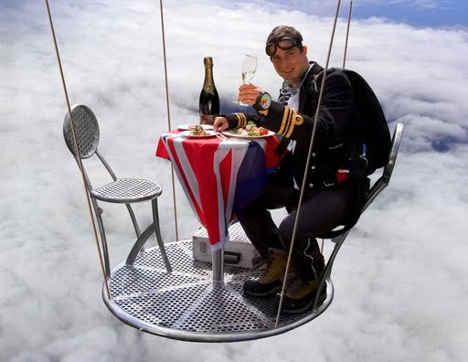 В 2005 году вместе с воздухоплавателем и альпинистом Дэвидом Хэмплманом-Адамсом и капитан-лейтенантом Аланом Вилом, руководителем парашютной команды Королевского морского флота, Беар Гриллс установил мировой рекорд для высочайшего официального званого ужина, который они провели в аэростате на высоте 25000 футов (7620 метров), одетые в парадную обеденную форму и кислородные маски. Для тренировки, перед этим событием Гриллс выполнил двести парашютных прыжков